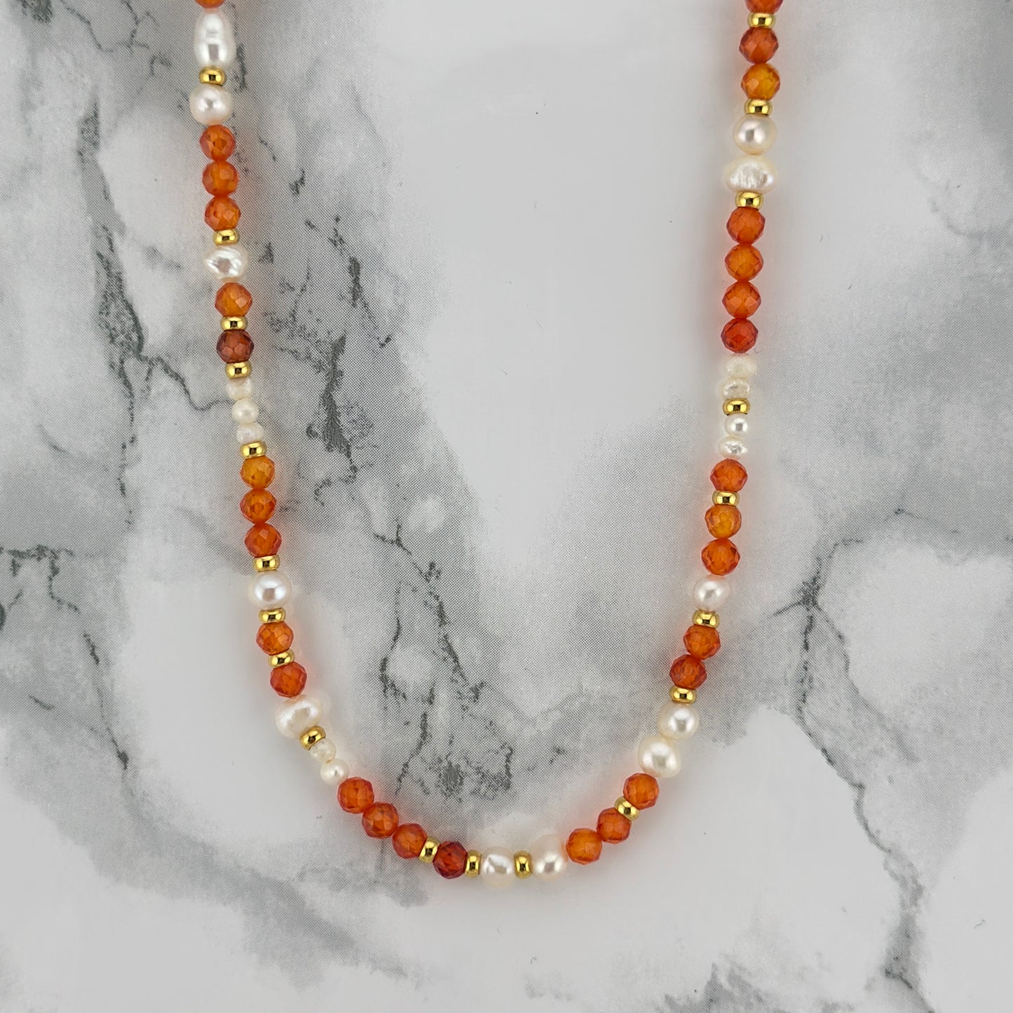Orange beads pearl
